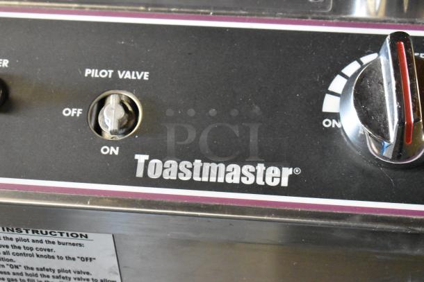Toastmaster TCT-1627 R stainless steel tandoor oven control panel with visible 'Pilot Valve' and 'Toastmaster' logo.