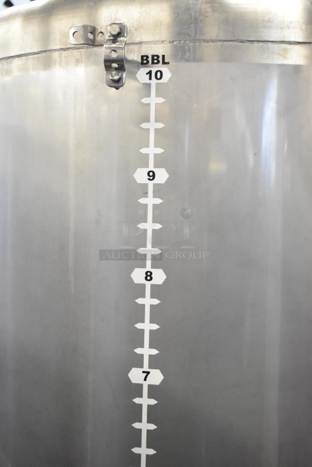 Stainless steel 10 BBL beer tank with volume markings; suitable for commercial use, in good condition.