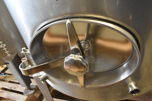 Stainless steel 10 BBL beer tank with secure lid and valve, used for tax determination. Excellent condition, ready for use.