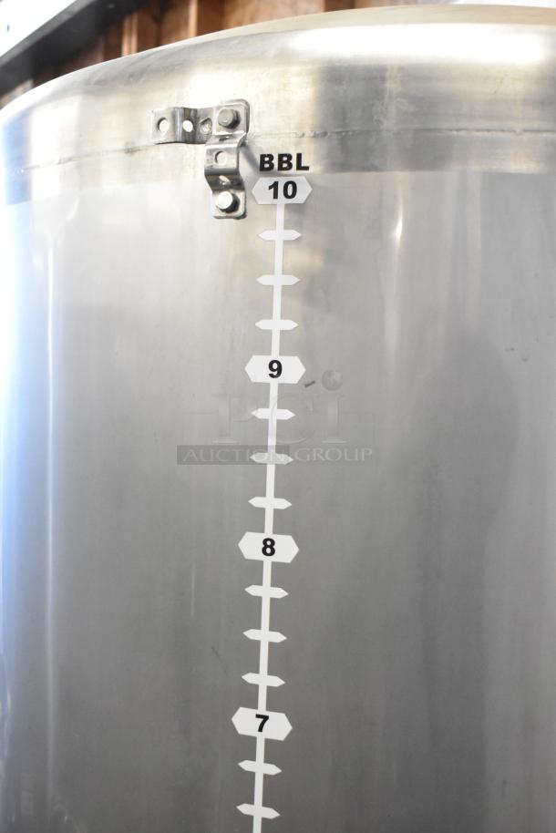 Stainless steel commercial 10 BBL / 420-gallon beer tank with measurement markings, in excellent condition.