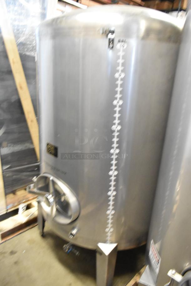 Stainless steel 10 BBL beer tank, 420-gallon capacity. Features volume markings, sturdy legs, and a front access port.