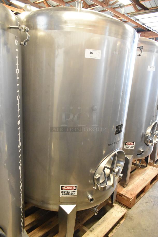 Stainless steel 10 BBL/420 gal commercial beer tank. Features volume gauge, caution labels, and tax determination markings.