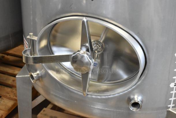 Stainless steel 10 BBL clear beer tank with access hatch. Features durable construction for commercial brewing.