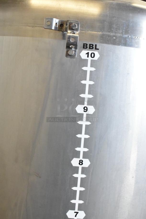 Stainless steel 10 BBL beer tax determination tank, marked for volume measurement, suitable for commercial use.