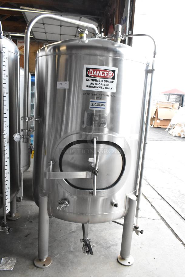 JV Northwest 10 BBL stainless steel beer brewing tank in good condition with caution labels and fermentation gauges.
