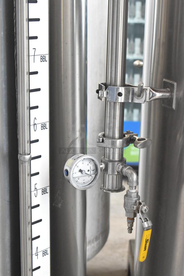 JV Northwest stainless steel 10 BBL / 420 gallon brewing tank. Features gauge, piping, and capacity markings. Excellent condition.