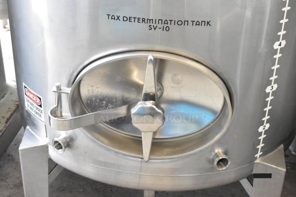 Stainless steel 10 BBL beer tax determination tank, marked SV-10, with secure lid and warning label. Excellent condition.