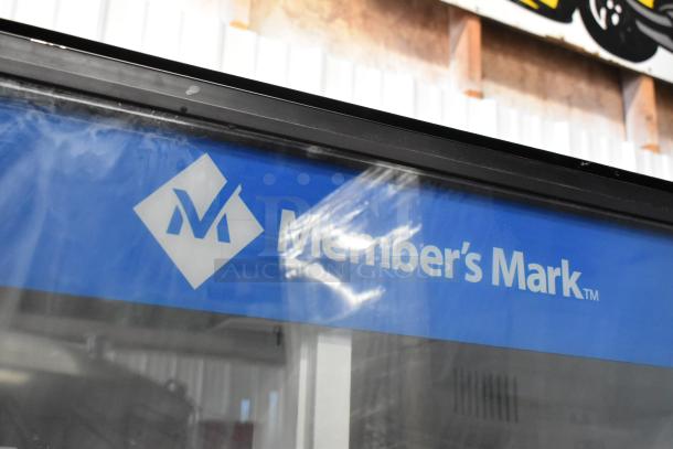 Metal commercial bottled drink vending machine, Member's Mark brand. Features 115 volts, 1 phase. Good condition.