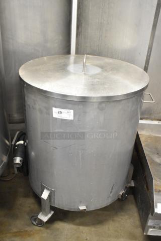 Metal commercial salad spinner on casters, silver finish, cylindrical design, visible wear, item label indicating "29 QTY".