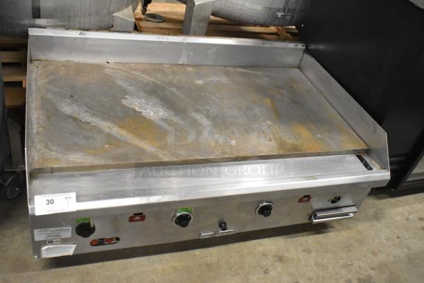 Southbend stainless steel commercial gas griddle, countertop model, with three control knobs in used condition.