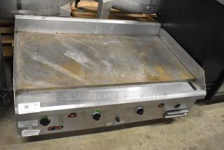 Southbend stainless steel commercial gas griddle, countertop model, with three control knobs in used condition.