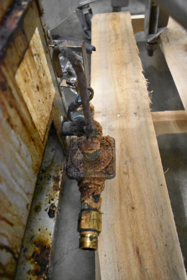 Southbend stainless steel gas griddle, rusty valve, fair condition, countertop model, worn surface, commercial use.