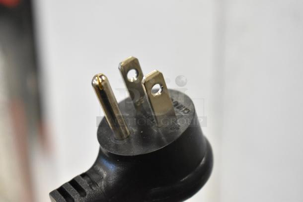 Close-up of a power plug for the True TBB-2G-HC-LD bar cooler, showing a 115-volt, 1-phase connection.