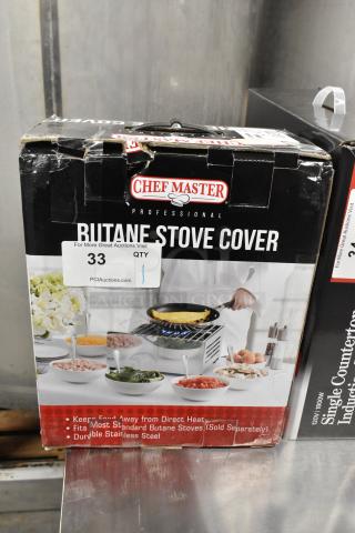 Brand new ChefMaster 90217 Butane Stove Cover in box, fits standard stoves, durable stainless steel. Box slightly damaged.