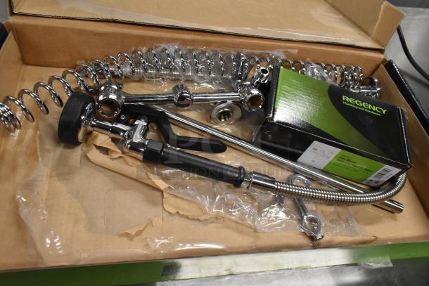 Brand new Regency 600PRA pre-rinse faucet base in box. Shiny chrome finish, includes hose and attachments.