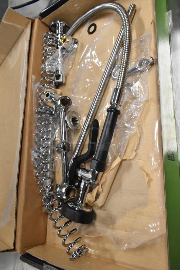 Brand new Regency 600PRA pre-rinse add-on faucet base in box, includes chrome components and flexible hose.