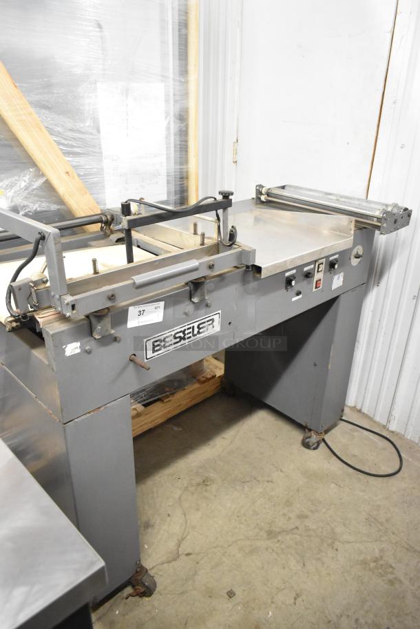 Beseler metal commercial countertop heat sealer, 115 volts, 1 phase, in used condition, features Beseler branding.