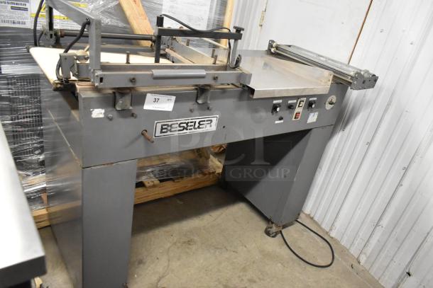 Beseler metal commercial countertop heat sealer, 115 volts, 1 phase, in used condition, labeled with model and controls visible.