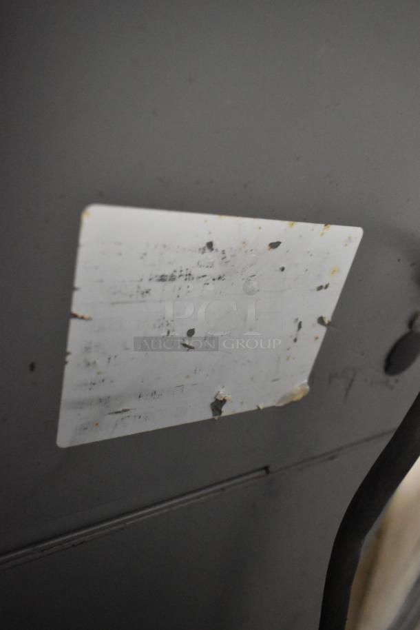 Beseler Metal Commercial Countertop Heat Sealer, 115 Volts, 1 Phase, with worn label indicating usage.