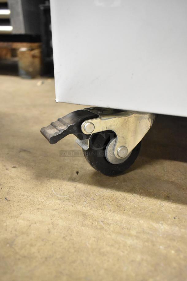 Excellence VBN-4 commercial chest freezer caster, featuring a sturdy metal frame and a poly-coated basket, 115 volts, 1 phase.