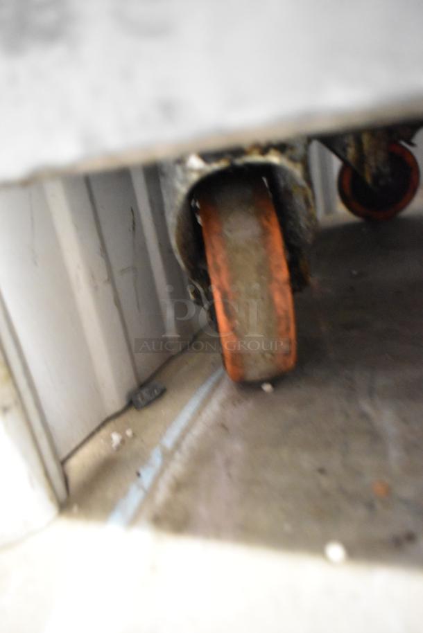 Pitco Frialator 35C fryer caster wheel. Worn condition, indicating mobility and use. Parts may require maintenance.