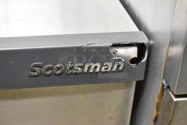 Scotsman C0830SA-32B Prodigy ice machine head, stainless steel, visible wear, 208/230V, 1 phase, cracked logo area.