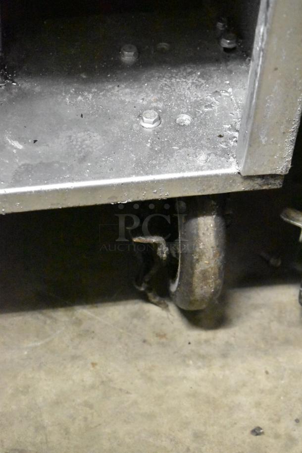 Sierra SRF-35/40NG stainless steel deep fat fryer, natural gas powered, on commercial casters, showing base condition.