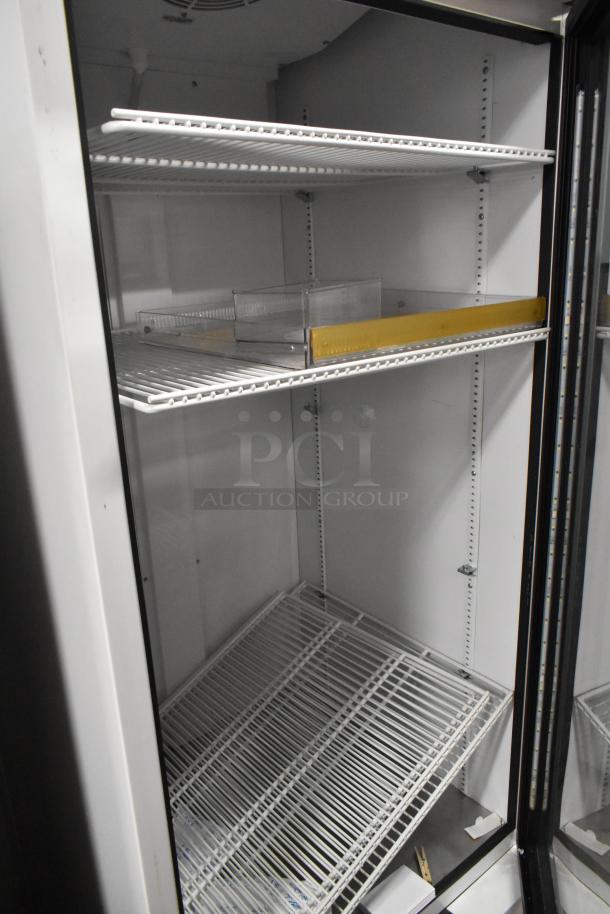 2021 True TSCI-600R-G-PH commercial cooler with glass door, poly coated racks, excellent condition, 115V, 1 phase.