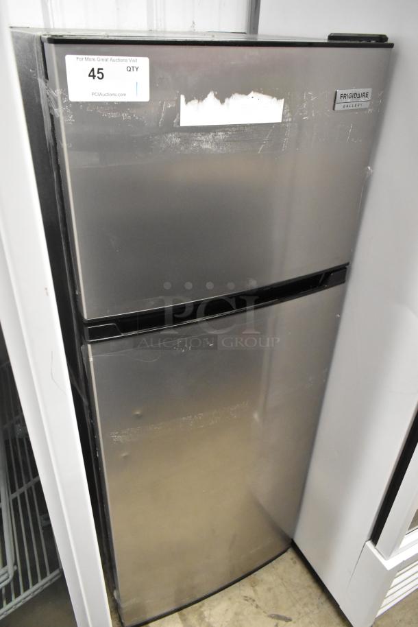 Frigidaire FGFR727 metal reach-in cooler with freezer, dual compartment, 115V, 1 phase. Shows signs of wear on surface.