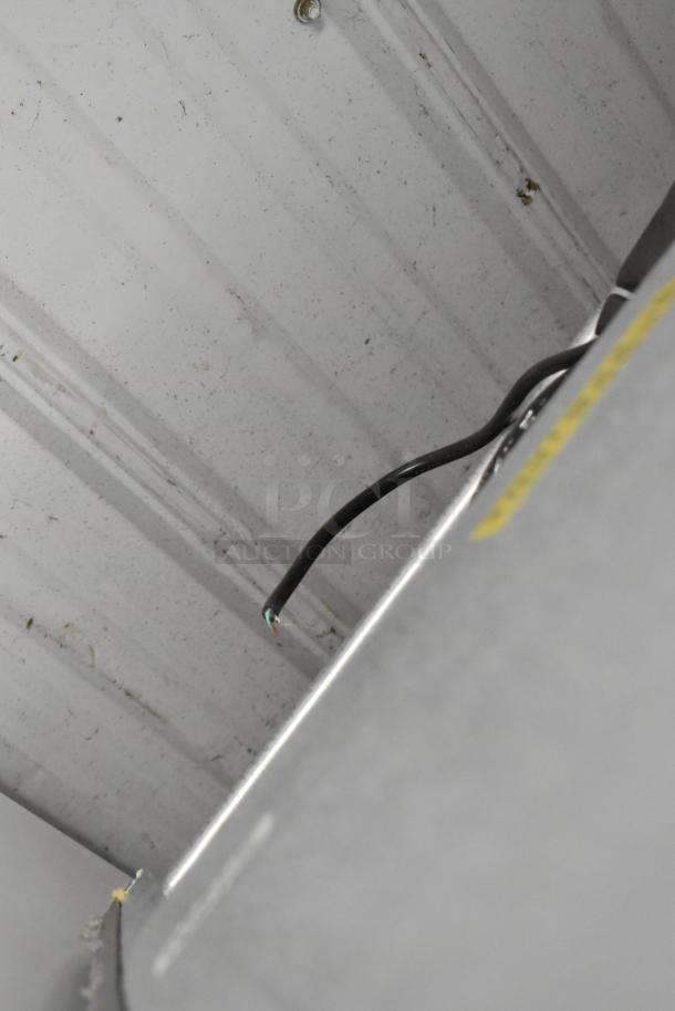 Frigidaire FGFR727 cooler with freezer, metal build, 115 volts, 1 phase, visible wiring, slight wear. Model allows versatile usage.