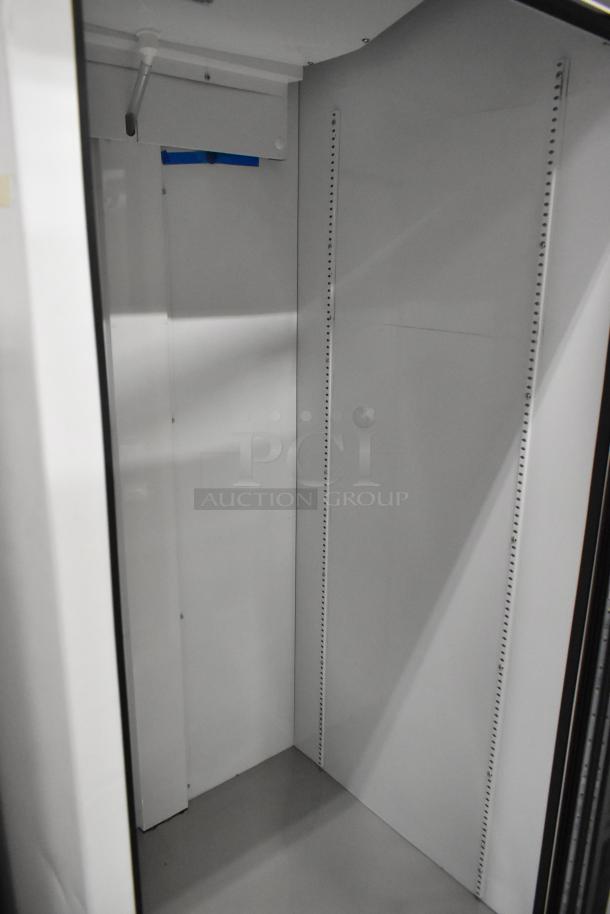 2021 True TSCI-600R-G-PH metal commercial single door cooler, features poly-coated racks, 115V, 1 phase, excellent condition.