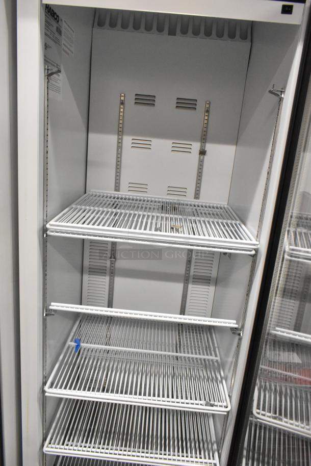2019 Habco SE18 metal cooler with single glass door, poly-coated racks, 115 volts, 1 phase, excellent condition.