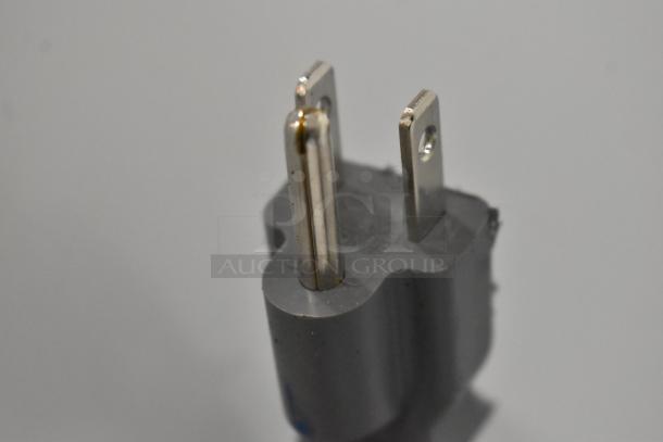 Close-up of a two-prong plug for a Frigidaire FFCM1155US Microwave Oven. 120 Volts, 1 Phase.