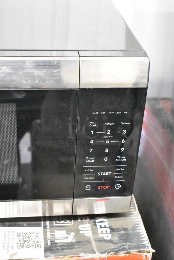 Frigidaire FFCM1155US microwave oven with control panel, stainless steel finish, 120 volts, includes rotating plate.