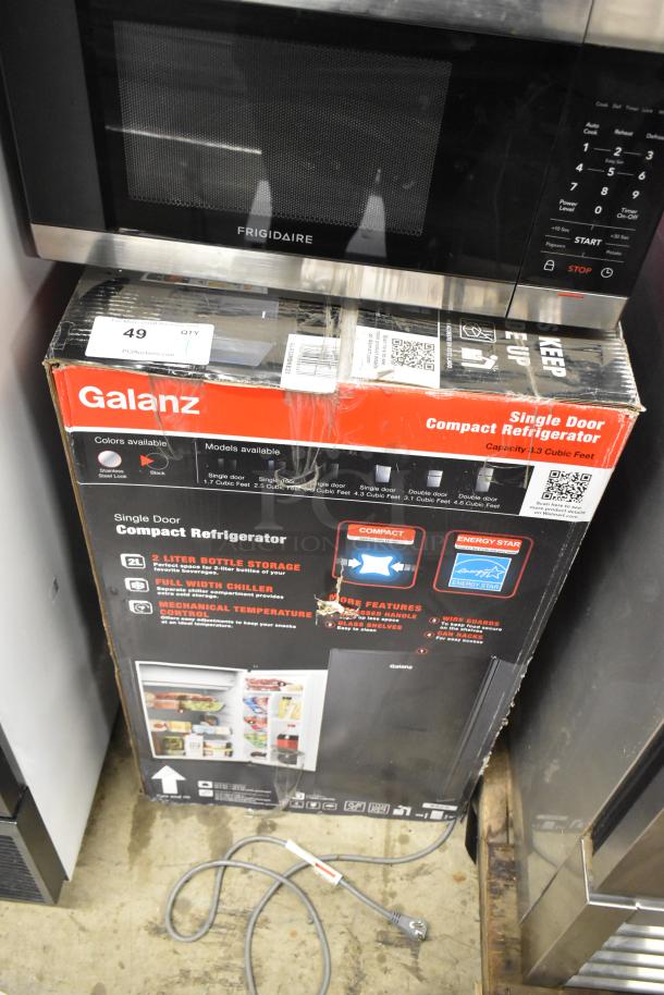 Brand new Galanz GLR33MBKE23 mini cooler in box; 115 Volts, single phase, 1.3 cubic ft capacity, Energy Star rated.