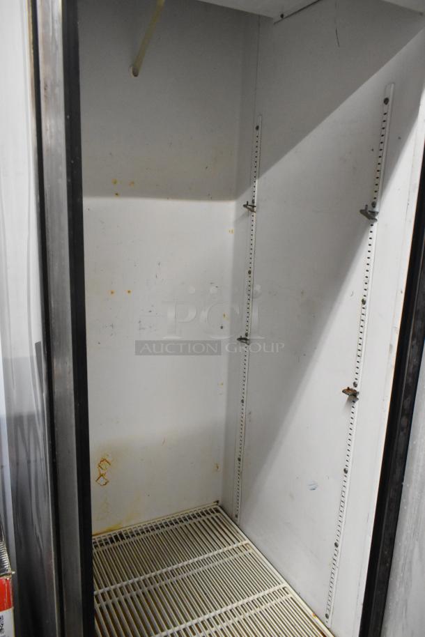 True T-23 Stainless Steel Single Door Reach-In Cooler, 115 Volts, 1 Phase, interior shelves, used condition.