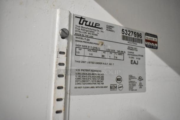 True T-23 stainless steel commercial single door reach-in cooler label, 115 volts, model details, and certifications visible.