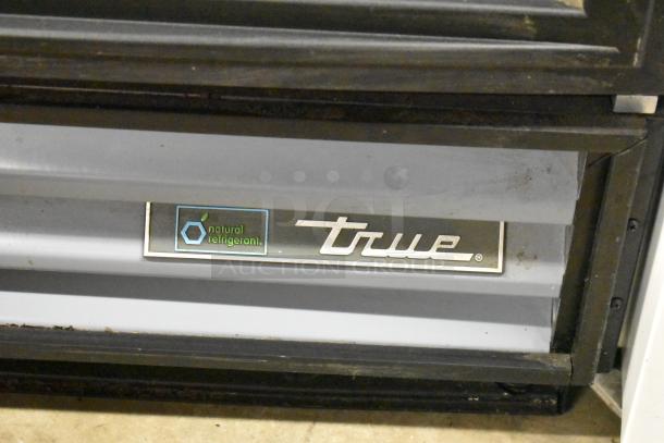 True GDM-12-HC-LD cooler, metal commercial single door, natural refrigerant label, poly coated racks.