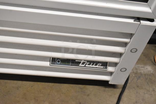 2021 True TSCI-600R-G-PH commercial cooler base, metal slats, True logo, natural refrigerant label, excellent condition.