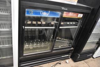 True GDM-41SL-48-HC-LD 2-Door Cooler, glass doors, poly-coated racks, 115V, commercial use, dairy and juice sections.