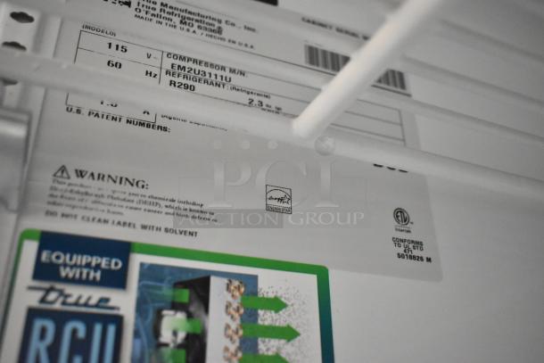 2021 True TSCI-600R-G-PH cooler labels showing model, voltage, refrigerant, Energy Star logo, and safety warnings.