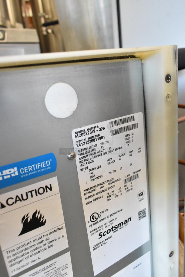 2024 Scotsman MC0522SW-32A stainless steel commercial ice machine head. Shows tags with model, voltage, certifications.