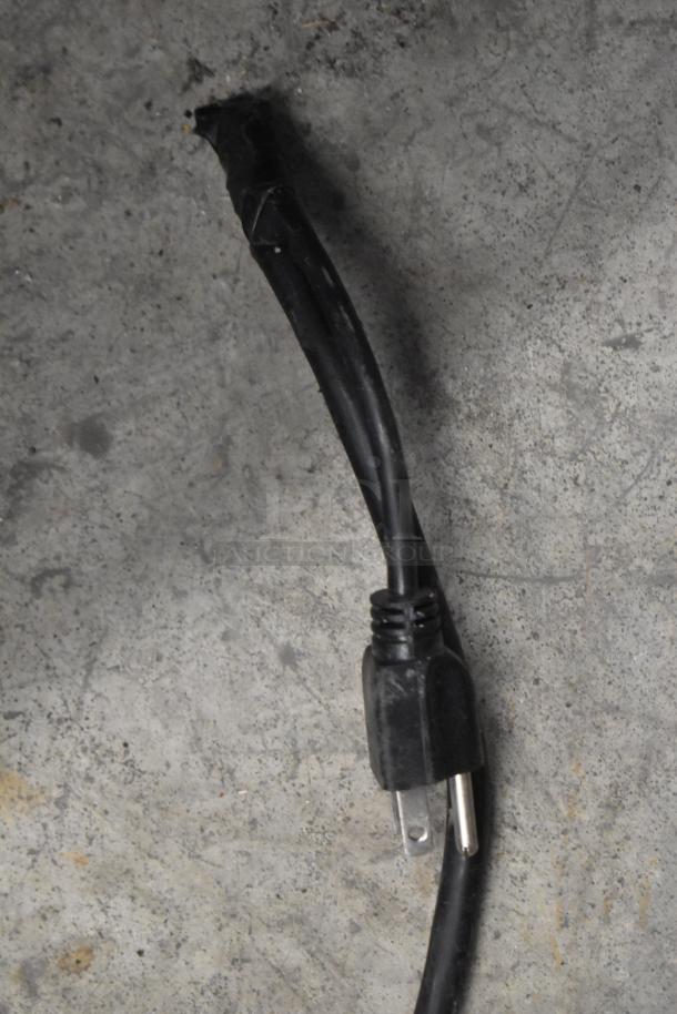 Close-up of the power cord for a Prince Castle CTS-WS contact toaster, showing a standard two-prong plug.