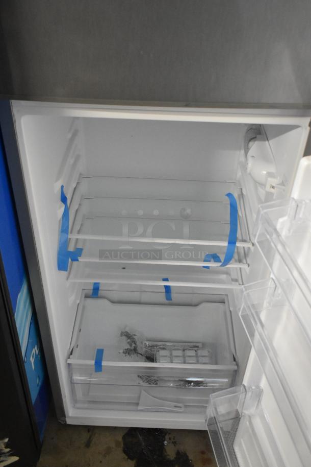 Frigidaire EFR780-T-6COM metal reach-in cooler with freezer, new condition, interior shelving and ice tray shown, 115V, 1 phase.