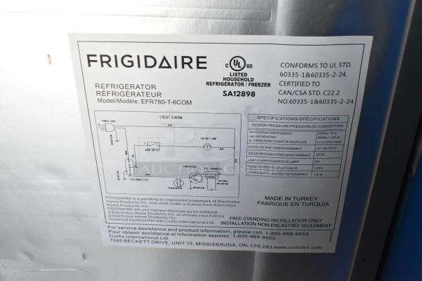 Frigidaire EFR780-T-6COM metal reach-in cooler with freezer, label shows specifications, 115 volts, 1 phase compliance.
