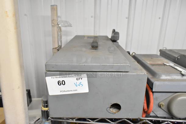 Five assorted power boxes, visible lot label "QTY x5", showing wear, suitable for industrial use. Quantity multiplied by bid.
