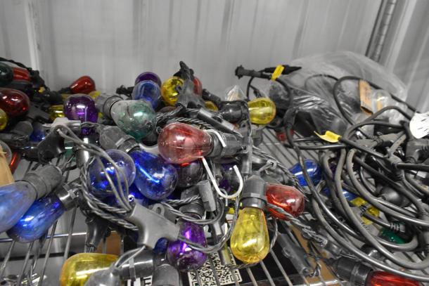 Multi-color string lights, 5 sets; includes red, blue, yellow bulbs. Used condition, tangled cords.