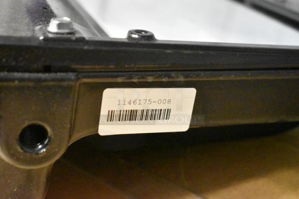 Four flood lights with black casing. Label reads "1146175-008" with a barcode. Auction includes four units.