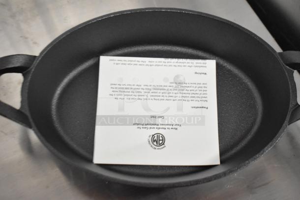 American Metalcraft 36 oz. pre-seasoned mini cast iron oval casserole dish, brand new, scratch and dent condition.