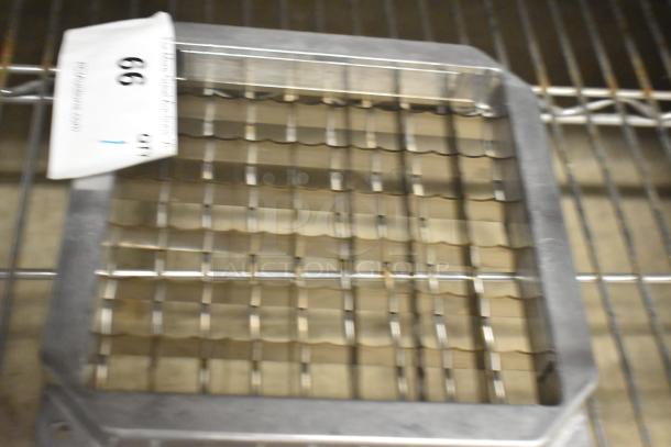 Brand new metal vegetable cutter blade with grid pattern. Scratch and dent condition. Auction tag reads "99."